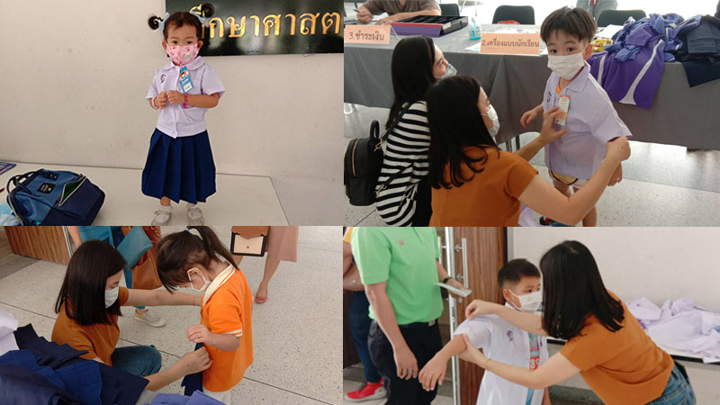 Parents of kindergarten and primary students brought their children to measure body for cutting the uniform